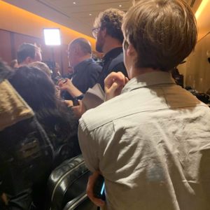 Christian Paas-Lang, intern with The Canadian Press’ Ottawa bureau, stands in a scrum of Liberal MPs after a committee meeting on the release of the ethics commissioner’s report into the SNC-Lavalin affair.