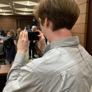 Christian Paas-Lang, intern with The Canadian Press’ Ottawa bureau, takes a picture of the parliamentary ethics committee, just before it sits to discuss the SNC-Lavalin affair.